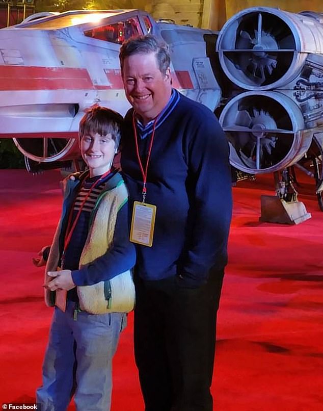 KTLA's Sam Rubin and his son Colby Rubin, who was nine years old at the time, are seen in a Star Wars movie in December 2016.