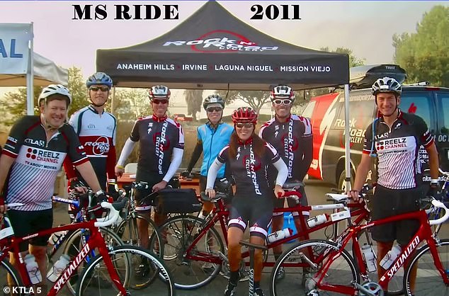 Rubin, left, is seen with co-workers participating in a charity bike ride in 2011.