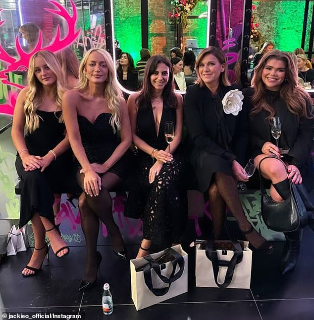 Elsewhere on Monday, Jackie and Kitty were seen smiling for photos while sitting together in the front row (left) for AFW's opening night.