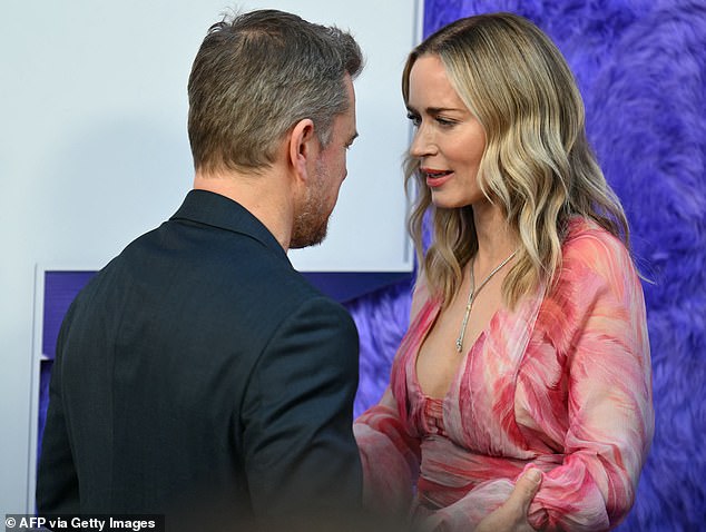 Damon flashed a smile as he posed on the red carpet with his wife of 18 years and spoke with his co-star Emily Blunt.