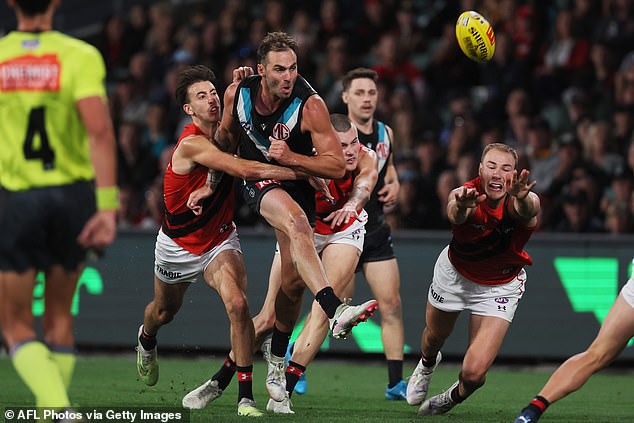 Port Adelaide star Jeremy Finlayson (centre) received a three-match suspension following his comment towards an Essendon player during the Gather Round last month.