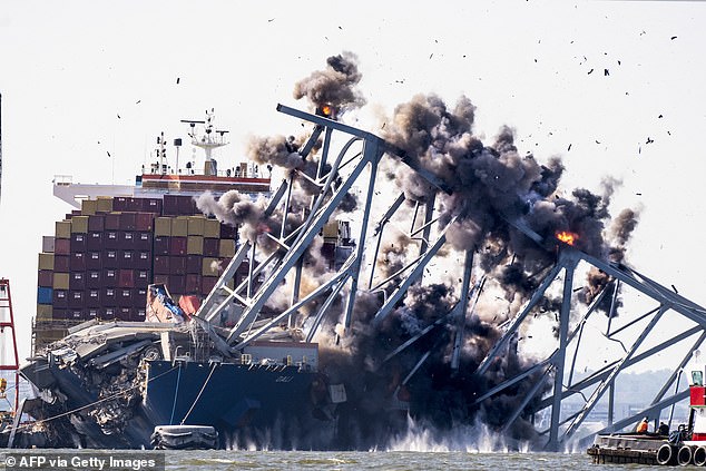 The explosion is seen from a frontal angle. This is moments before the bridge falls into the river.