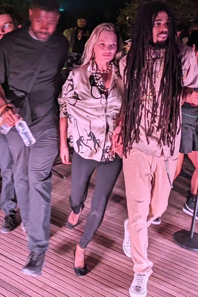 It comes hours after Kate (centre) was pictured holding hands with Skip Marley (right) in Turkey at the weekend after running on stage during his performance.