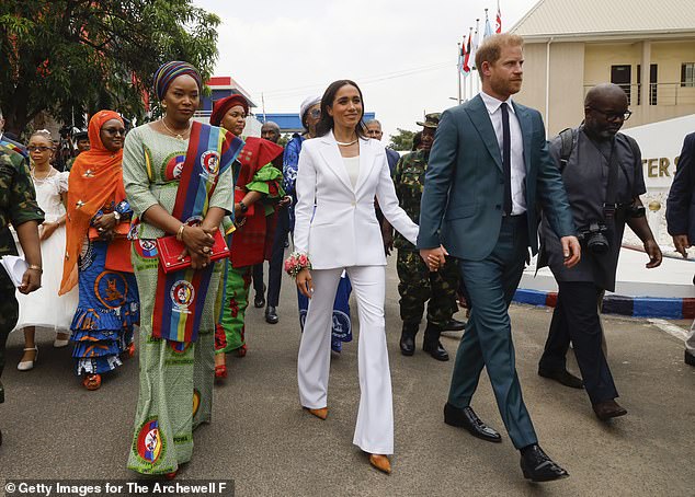 Meghan and Harry were a colorful team when they stepped out in colors that pay homage to the Nigerian flag.