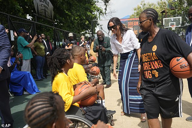 Meghan talks to the kids after their basketball game.