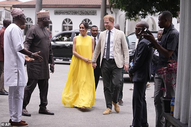 A brightly dressed Meghan arrives at the Lagos State Governor's house in Lagos.