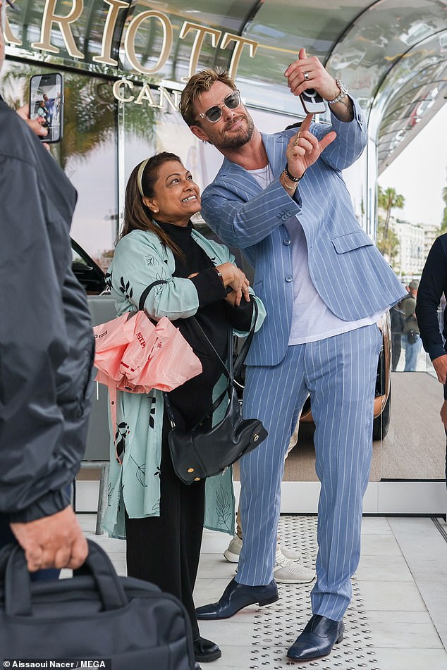 Meanwhile, actor Chris, 40, looked French chic in a tailored blue and white suit and casual T-shirt.