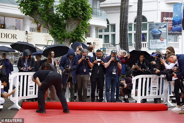 Team members were seen laying out the iconic red carpet, ready for a host of celebrities to make their debut at this year's ceremony.