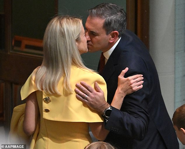 Dr Chalmers (pictured with his wife, Laura) defended the payment aimed at Australia's highest earners, saying: 