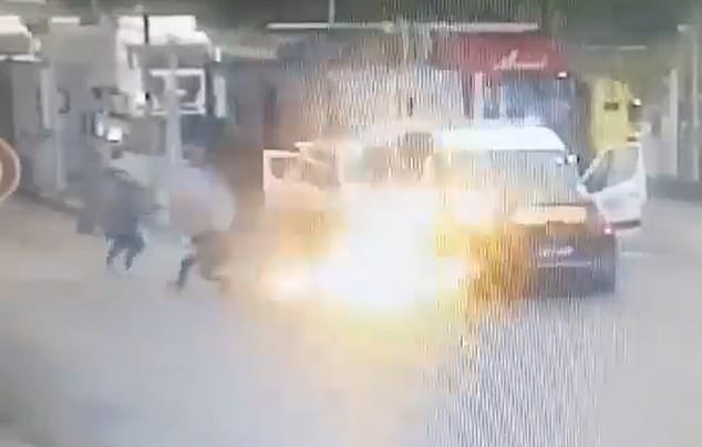 An explosion is seen that gives the attackers and the released detainee cover to run and escape from the scene.