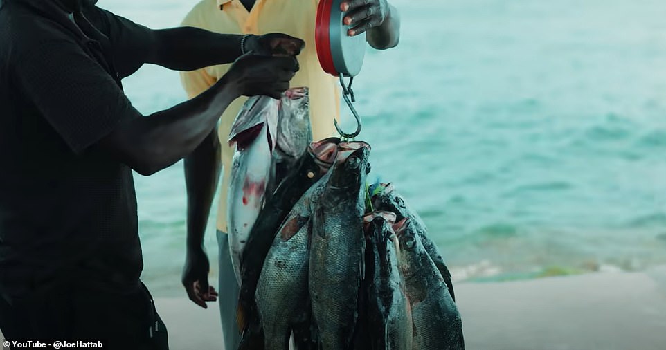 One of the filmmaker's ports of call in Migingo are the fishing docks, where he sees fishermen in action.