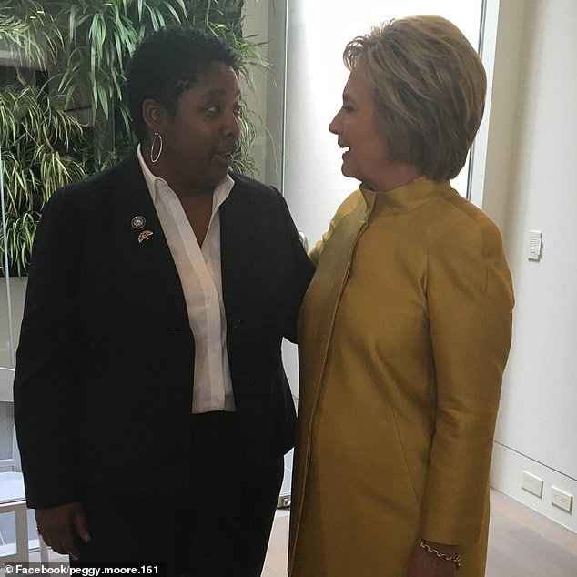 Moore is seen here with Hillary Clinton, who ran as the Democratic Party candidate in the 2016 US presidential election.