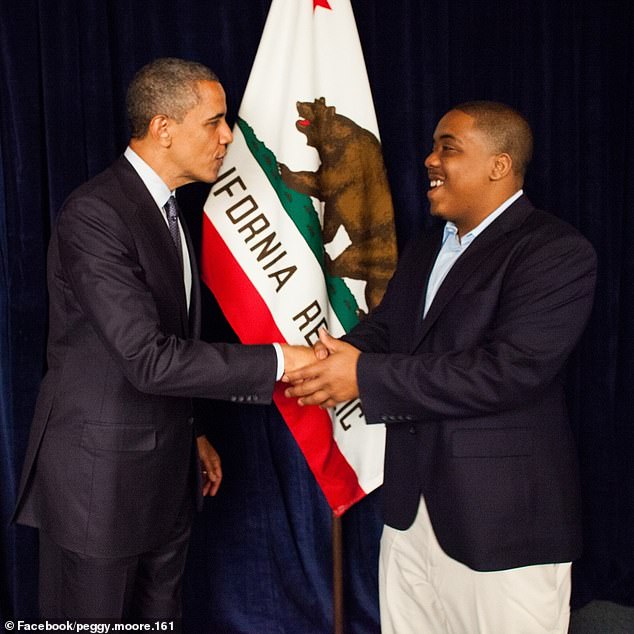 Moore had worked as deputy field director for Obama's 2008 campaign (both seen here) and was a senior adviser to former Oakland Mayor Libby Schaaf.