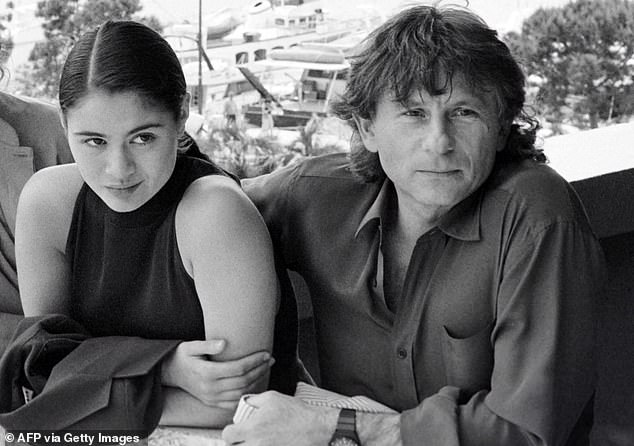 This file photo taken on May 8, 1986 shows film director Roman Polanski (right) and British actress Charlotte Lewis (left) posing before the presentation of the film 'Pirates', during the Cannes International Film Festival . Lewis was 16 years old when she appeared in the film.