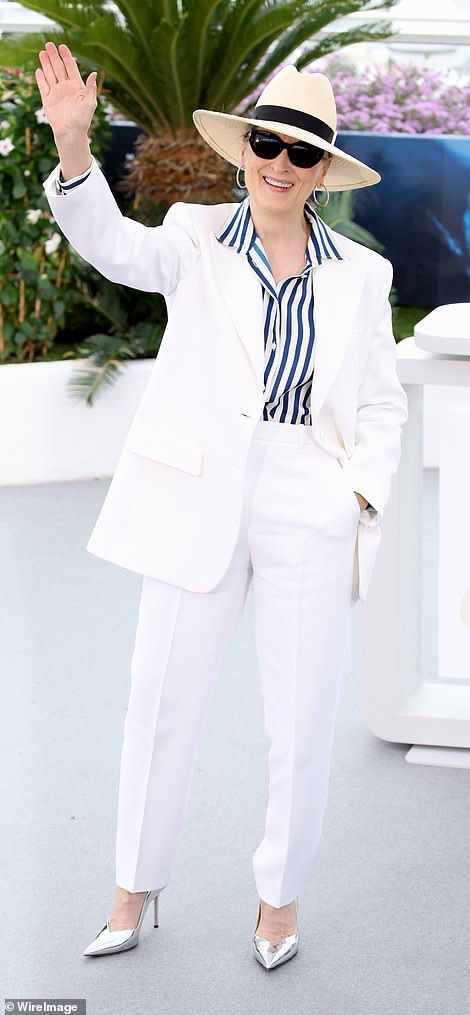 The Oscar-winning actress, 74, who will receive an honorary Palme d'Or at the 77th annual event, wore a white jacket and matching pants, paired with a blue striped shirt.