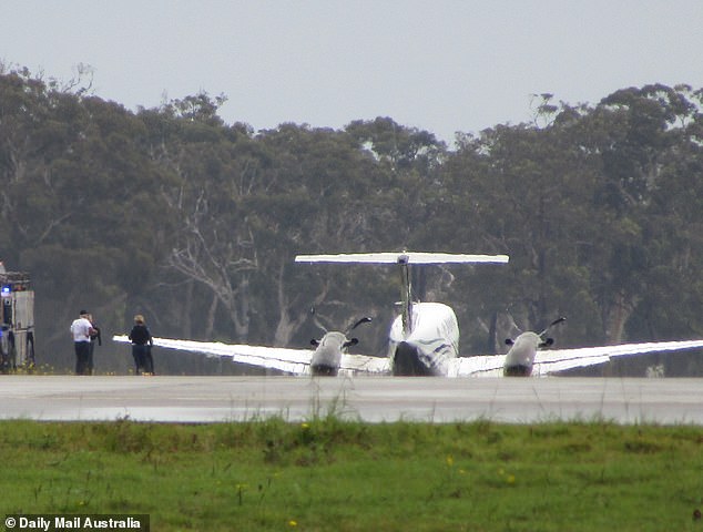 Hundreds of spectators who had gathered at the airport applauded when the plane made a successful 