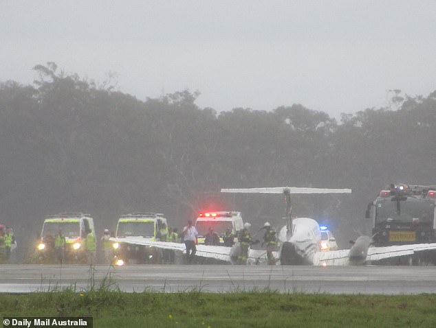 The plane flew over Newcastle Airport for four hours while burning fuel before attempting the dangerous landing in rain and limited visibility.