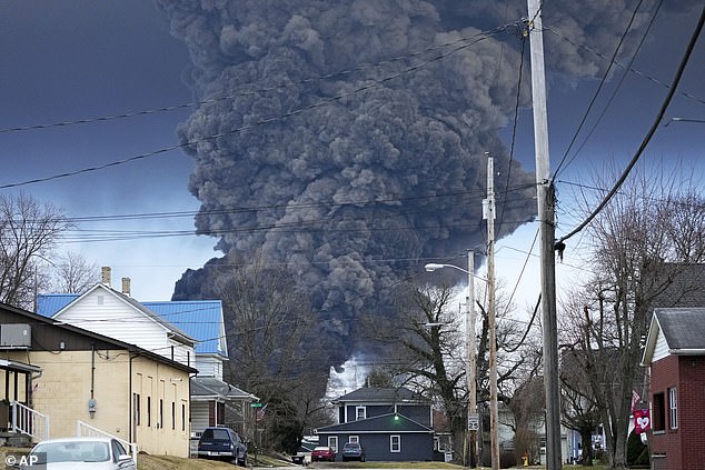 Officials were forced to conduct a controlled detonation of a portion of the derailed train while it was filled with hazardous materials, causing a massive plume of toxic smoke to fill the East Palestine, Ohio, area for several days, pictured in the photo. February 6, 2023.