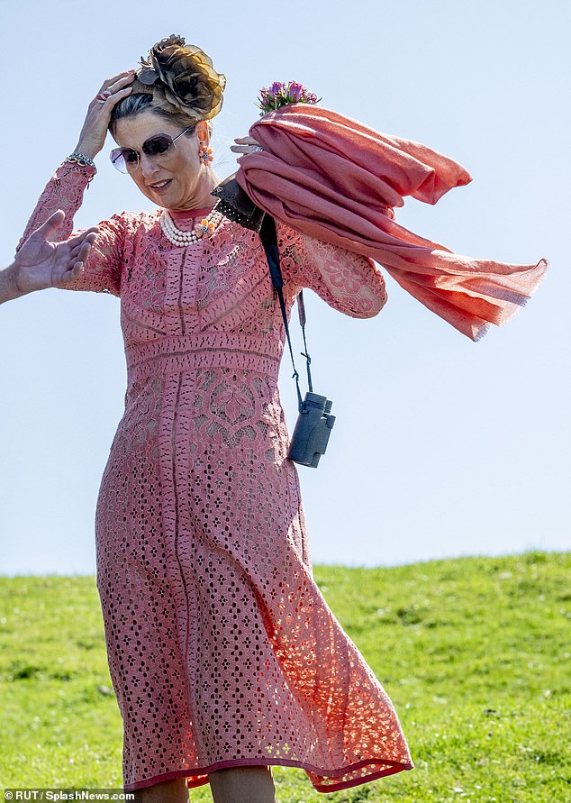 Hold on to your hats! Queen Máxima fights against the wind in windy Hogeland today