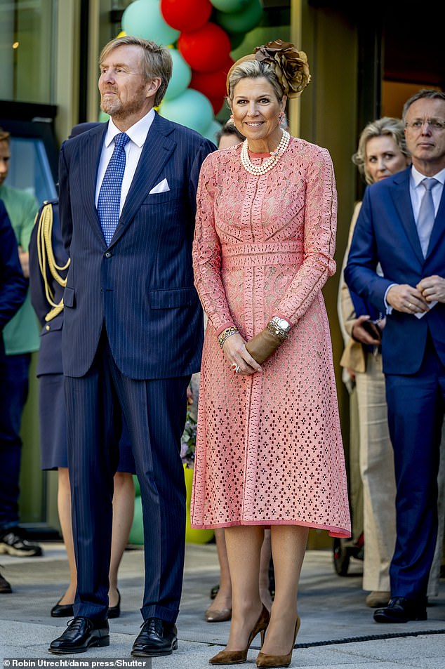 King Willem-Alexander channeled a dapper look and opted to wear a navy striped suit with a crisp white shirt and a blue patterned tie, complete with a handkerchief.