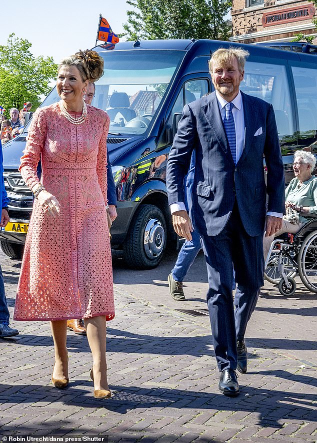 The Queen wowed royal fans in a blush-coloured long-sleeved lace dress, which had panels at the waist, showing off her slender figure.