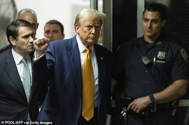 Trump, pictured in Manhattan Criminal Court on Tuesday, is accused of allegedly concealing the nature of payments he made to adult actress Stormy Daniels in the run-up to the 2016 presidential election.