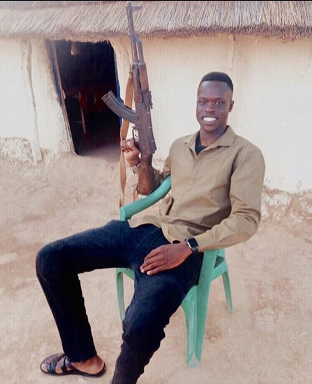 Kuol Mawien Kuol, pictured in Sudan with an AK-47, was arrested by Victoria Police's gang crime team on Thursday.