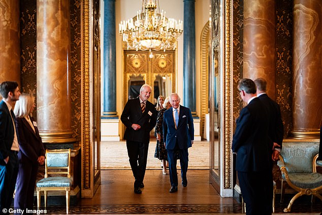 King Charles smiles as he arrives at today's opening, at which he sat four times, starting when he was Prince of Wales in June 2021.