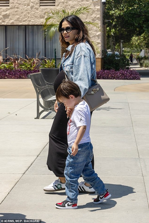 The 43-year-old actress and dancer was seen getting out of her vehicle with her four-year-old son Callum Kazee in her arms, while her fiancé Steve Kazee carried some of her bags by her side.