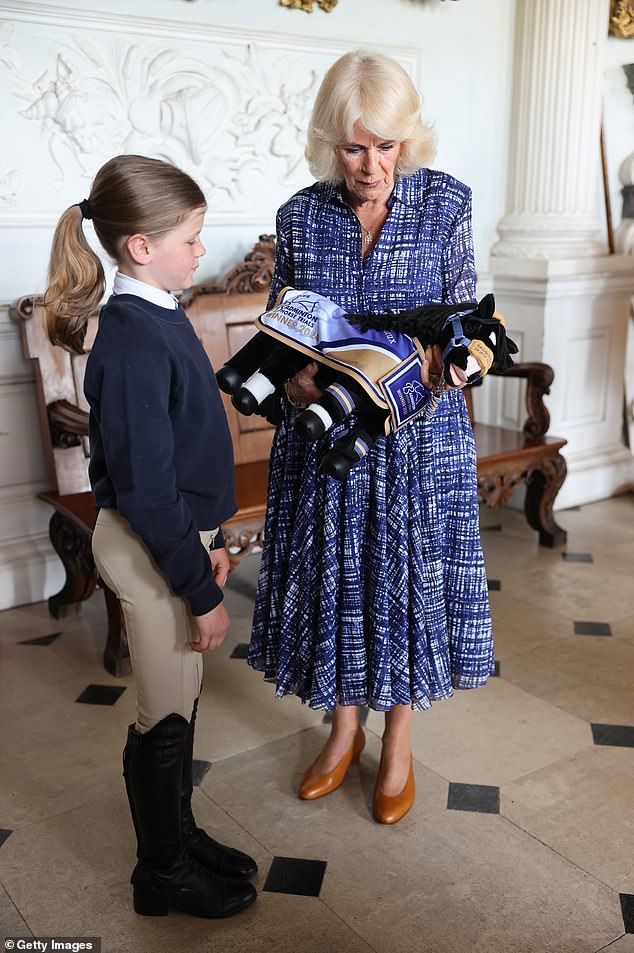 At the event, Camilla presented a stuffed pony to Rhea Salt, 10, a Beaufort Pony Club runner.