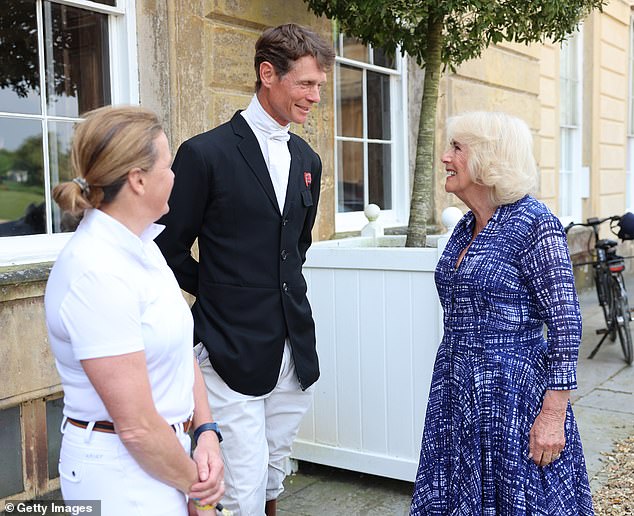 Camilla is greeted by previous winners Pippa Funnell (left) and William Fox-Pitt (centre) as she arrives to attend the final day of the Badminton Horse Trials.