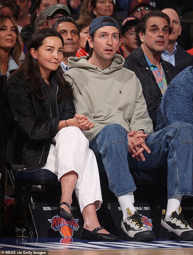 Actor Nicholas Braun was wide-eyed as he enjoyed the game in a beige sweatshirt and blue jeans.