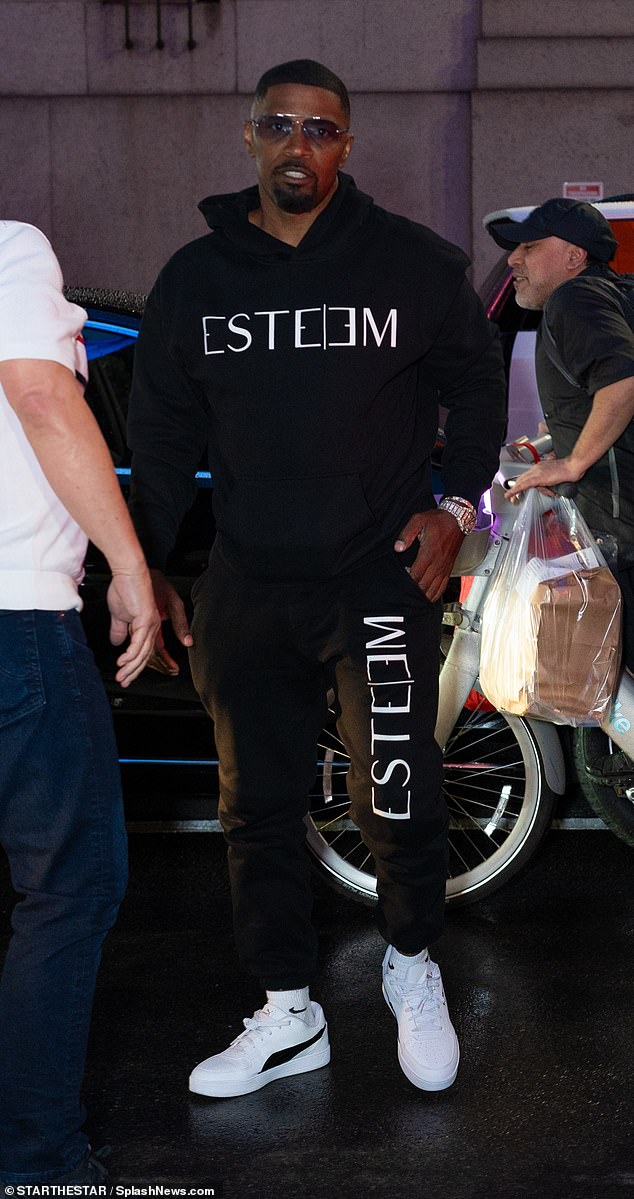 Foxx wore a black Esteem sweatshirt with a pair of white Puma sneakers.