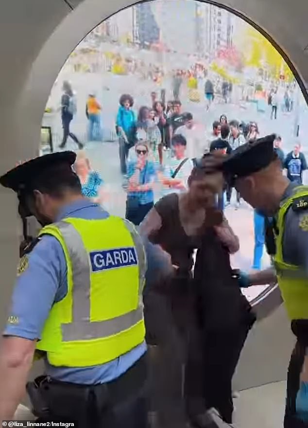 Another video showed a woman being dragged out of the portal by police after rubbing herself against the screen.