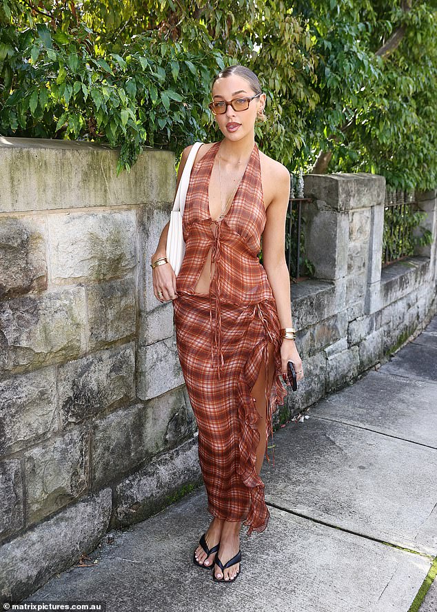 Sammy Robinson looked effortlessly chic in a plaid ensemble, which she paired with black flip-flops.