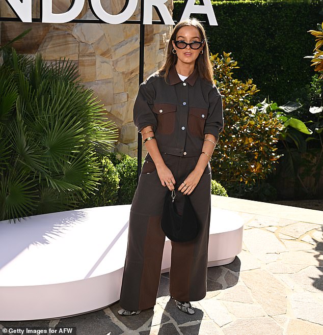 Brooke Upton looked chic in a brown patchwork ensemble as she joined the guest list.