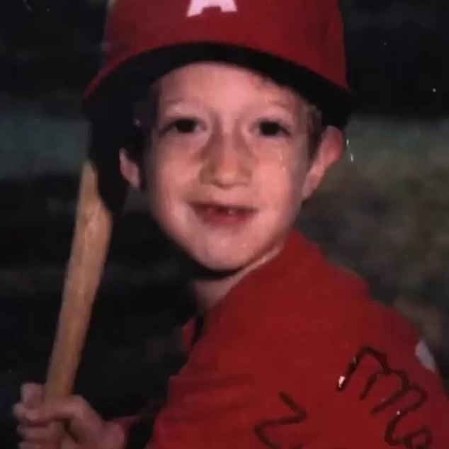 One of Zuckerberg's photos when he was younger shows him holding a baseball bat and wearing a red T-shirt and matching red cap.