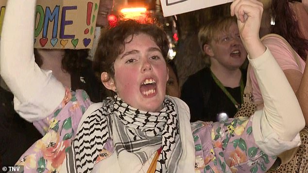 A woman who opposes the book ban appears at a protest in western Sydney on Wednesday night.