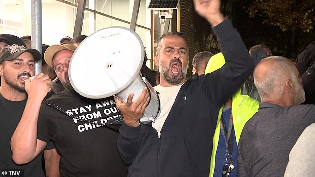 Supporters of the council's same-sex book ban are pictured at the protest outside Cumberland Council offices.