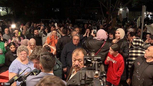 Protesters appear at a rally by rival factions in western Sydney on Wednesday night.