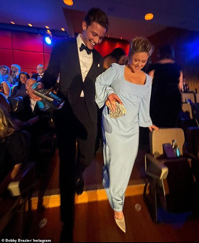 Bobby was pictured helping pregnant TV star Emily Atack at the ceremony, escorting her down the stairs to ensure her safety.