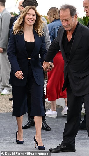 The actress, who stars in the new release, was dressed to impress in a short black jumpsuit paired with a navy blue jacket.