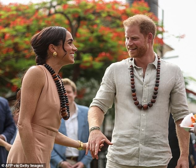 Meghan accessorized her outfit with some glamorous makeup, including pink lip gloss, lots of blush, and smoky eyeshadow. Her hair looked equally glamorous, and Meghan opted for a ponytail of soft curls.