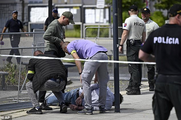 Police arrest a man after Fico was shot and wounded following the cabinet session outside his home in the town of Handlova, Slovakia, Wednesday, May 15, 2024.