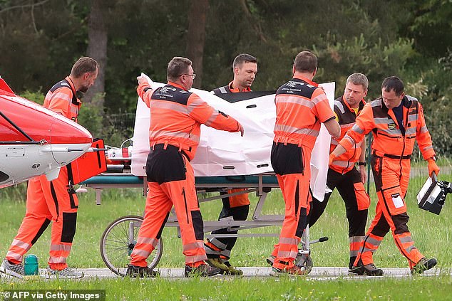 Slovak Prime Minister Robert Fico is transported from a helicopter by doctors to Banska Bystrica hospital, where he will be treated after receiving 