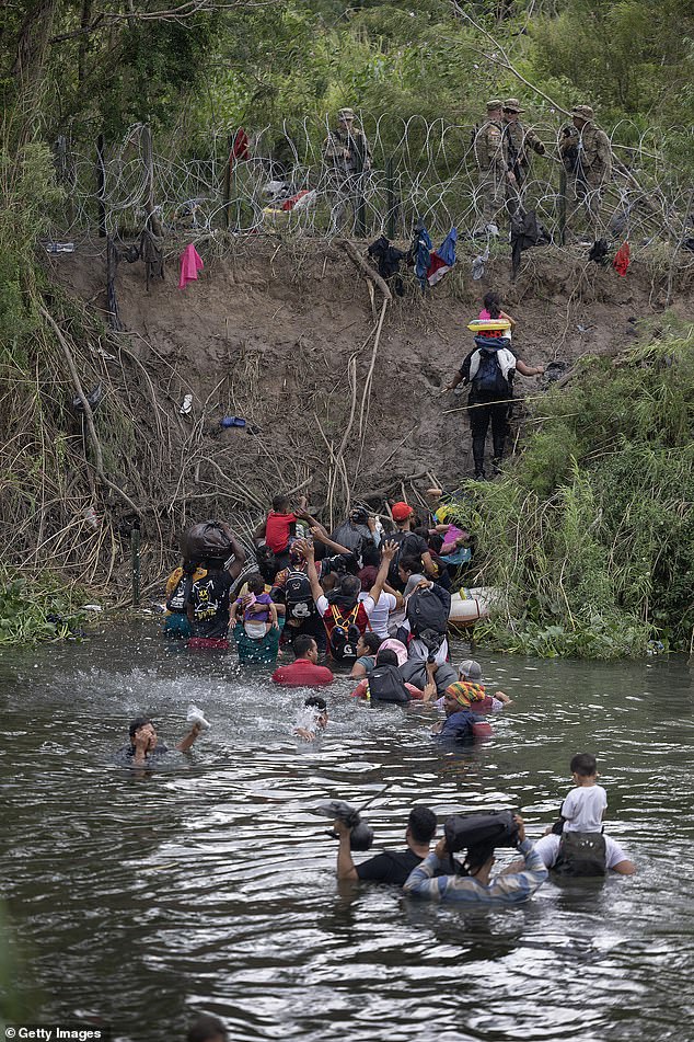 He suggested that skilled immigrants could fill nursing and fast-food worker jobs. Pictured: Migrants swim across the Rio Grande as they attempt to enter the United States on March 10, 2023.