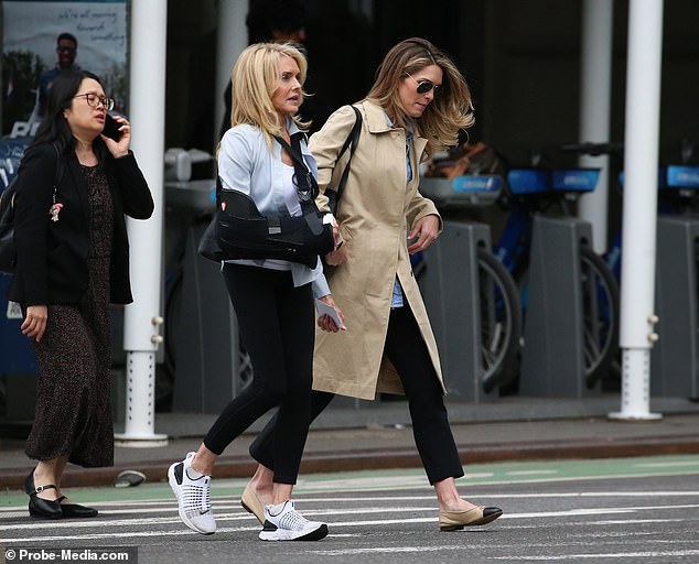 Her mother Caye, whose right arm was in a sling, was a little more casual but still stylish in a light blue collared shirt, black leggings and sneakers.