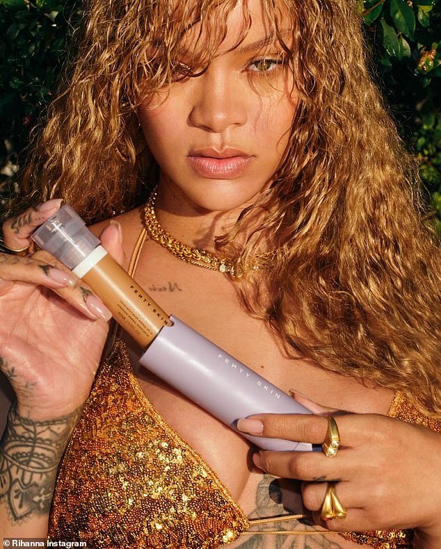 The 36-year-old mogul shined in a sparkly gold bikini top as she pumped her latest Fenty Skin product onto the back of her hand.