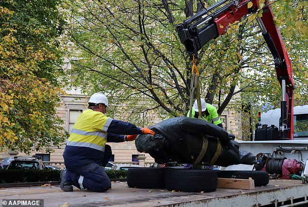 City workers were seen removing the monument from the area on Wednesday morning, loading it onto a truck and taking it away (pictured).