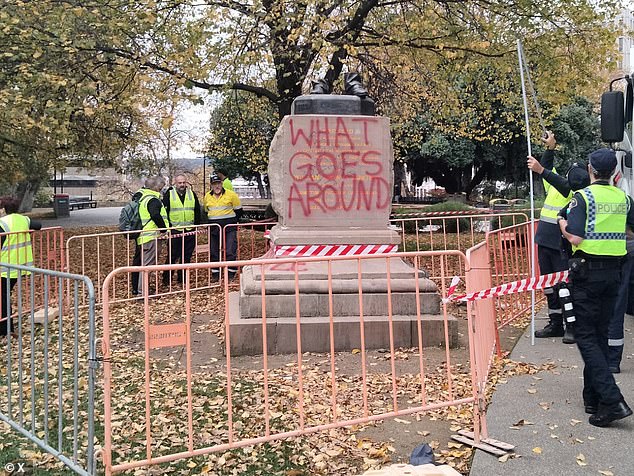 The pedestal was also spray painted red with the words 